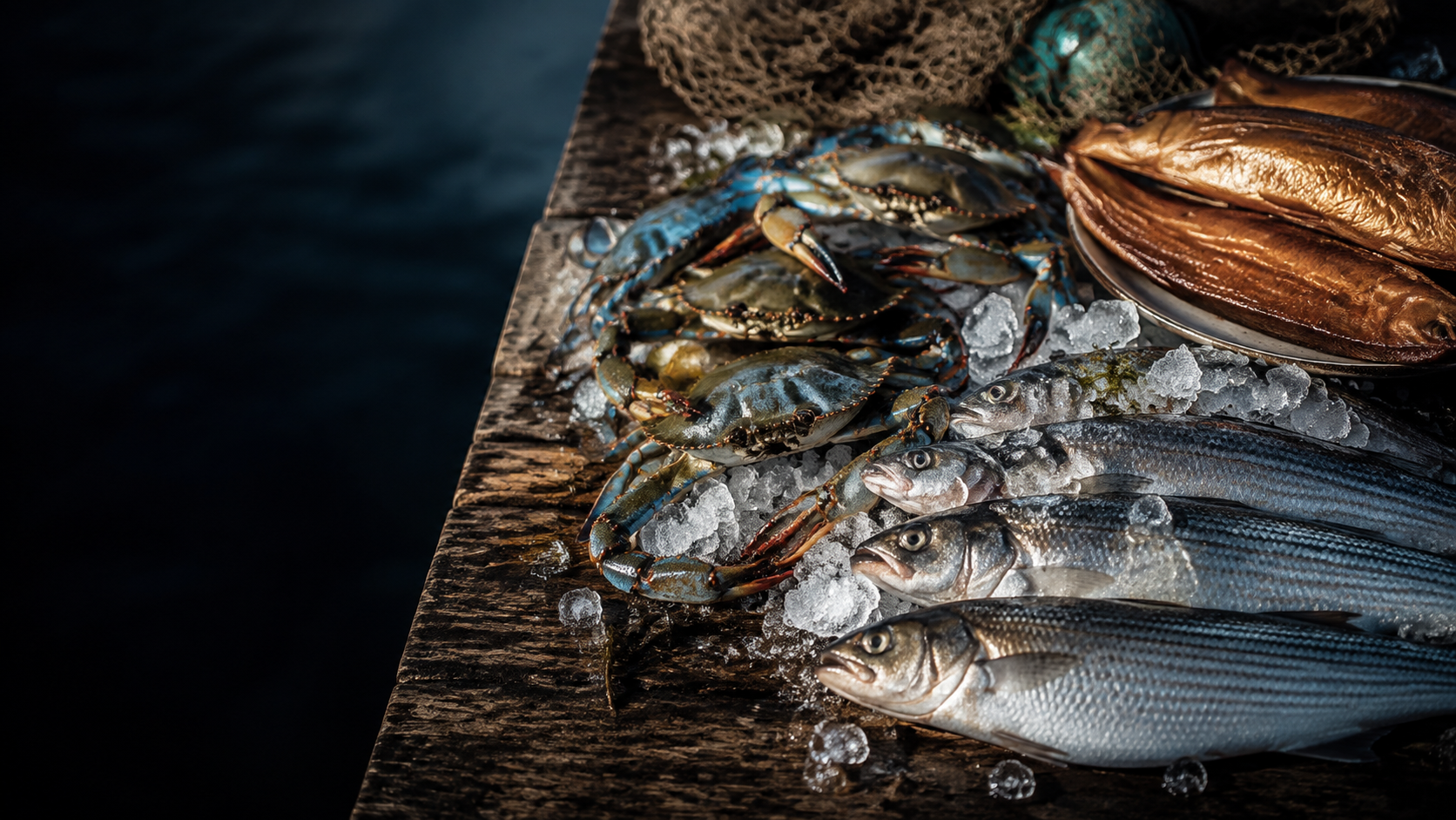 Fresh blue crabs and mullet displayed on ice